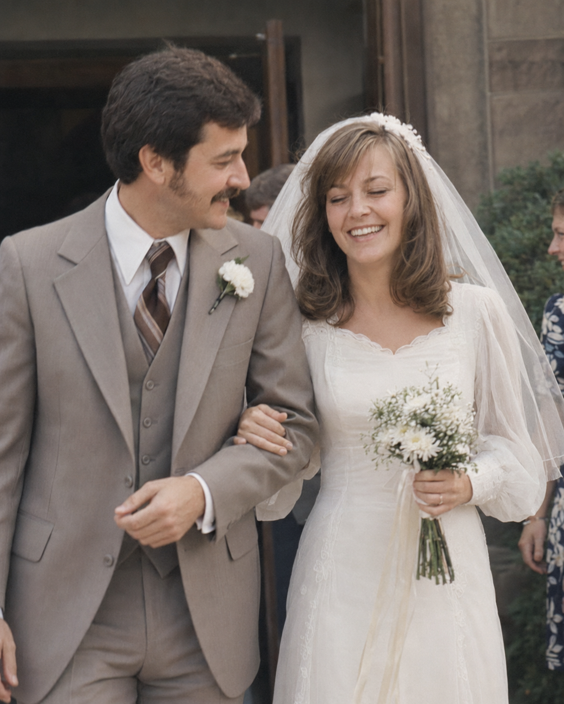 James and his wife smiling together on their wedding day
